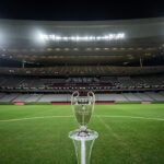 Champions League trophy on the pitch at a football stadium